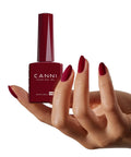 Hand holding Six Colors 9 Ml Hema Free Deep Cherry Red Burgundy Gel Nail Polish Set With Blood Wine Red Hues Ultra Rich Pigments
