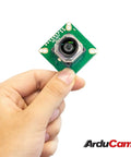 Person holding IMX477 Autofocus HQ Camera With Motorized Focus And I2C Control Fine Tune With Keyboard Arrows Or Autofocus With OpenCV 12MP Sensor 100 Degree FOV M12 Lens OpenCV Ready Jetson Orin NX AGX Orin Compatible No Hardware Mods Needed No Hassle Use module showing front view.