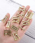 12 Piece Clock Numerals Kit For DIY Repair Arabic And Roman Digits Quartz Wall Clock Parts in hand showing gold numerals