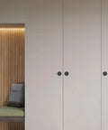 2 Pack Sliding Closet Door Finger Pulls Black Finish installed on white closet doors, no nails needed, fits two and one eighth inch holes.