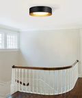 Black And Gold Flush Mount Ceiling Light With Glass Drum Shade Sixteen Point Five Inch Sleek Modern Round Fixture installed on ceiling