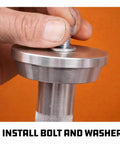 Close-up of a hand installing a bolt on the 10 Pc Master Bearing Race And Seal Driver Kit With 9 Precision Wheel Inserts