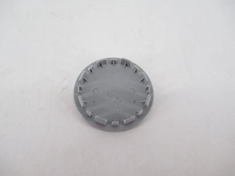 Back view of Subaru Wheel Center Cap 28821VA011 Black Hub Cap Replacement showing attachment details