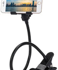 Badass Flex Gooseneck Cell Phone Holder For Desk And Bedside Ultra Tough Long Arm Clip Mount compatible with all iPhones and Android phones, showing a smartphone in a view of the city.