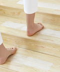 Pre Cut 30x6 Anti Slip Stair Treads 15 Pack With Roller Clear Non Slip Grip Strips on wooden stairs with bare feet