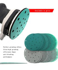 Close-up of a 6 inch heavy duty sanding disc with 17 holes on a random orbital sander, ideal for wet and dry projects.