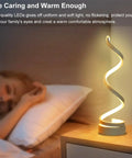 Spiral LED Desk Lamps Set Of 2 10W Modern Bedside Lights with warm glow on nightstand next to sleeping person in bedroom.