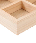 Close-up view of the six compartment pine wood jewelry tray, showcasing its natural finish and divided bins.