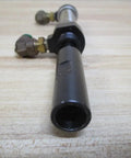 Industrial Hydraulic Cylinder 10mm Bore With Two And One Half Inches Stroke PN 13316050001 close-up side view on wooden surface.