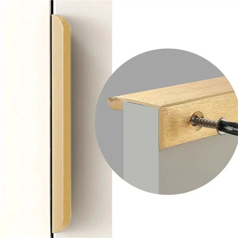 Close-up of hidden cabinet handle in brushed bronze aluminum, 500mm length, showing concealed installation for sleek cupboards.