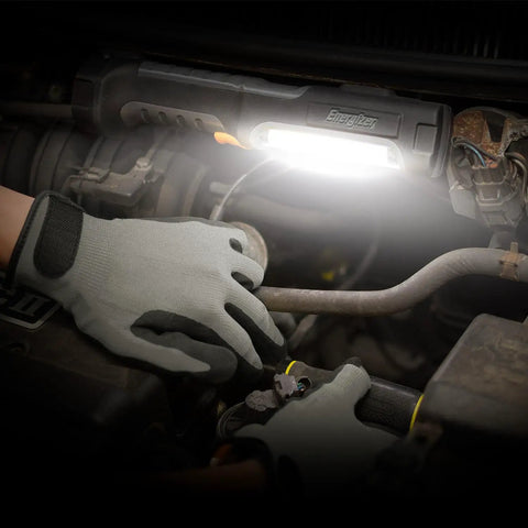 HC550 LED Flashlight Pack Of 2, Water Resistant Magnetic Work Light illuminating a car engine, showing rugged design in use