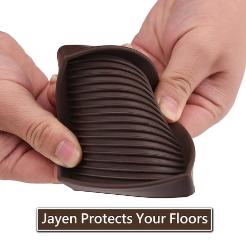 Person holding a brown 3x3 Square Rubber Furniture Caster Cup Anti Slip Pad Bed Stopper Floor Protector with Grip