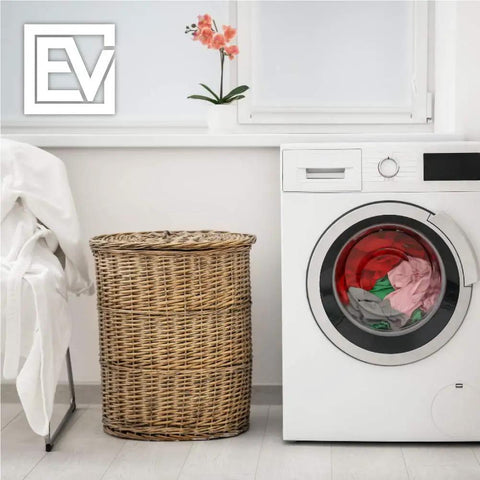 Laundry room with a white dryer, wicker basket, and folded clothes. Promotes use of 12 Pack Dryer Lint Filter Replacement For Better Vent Indoor Dryer Keep Lint Out And Air Clean Up To 60 Dryer Loads Value Packed And Easy To Install With Simple No Fuss Setup.