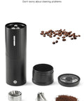 Portable Electric Coffee Burr Grinder With 50g Capacity And Magnetic Cover Aluminum Alloy Body External Adjustable Settings Ultra Quiet Brushless Motor Fast Grinding Powered By 800mAh Rechargeable Battery Black Edition disassembled showing parts and coffee grounds.