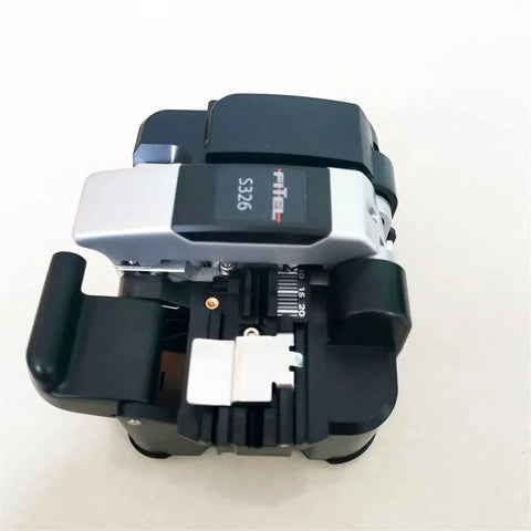 Battle Tested Pro Grade Optical Fiber Cleaver Precision Cutting Rig For Fusion Splicers and Telecom Fixes top view showing steel frame and cutter.