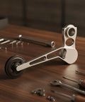 Rear Derailleur Chain Tensioner With 11T Pulley For Folding Bikes on a wooden table, showcasing aluminum build and pulley details.