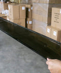 Heavy Duty Black Stretch Wrap 1500 Ft Roll With Hand Saver Handles 15 Inch Wide 70 Gauge Shrink Film shown in use for moving.