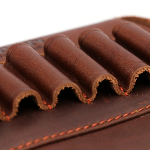 Close-up of Genuine Leather Buttstock Cheek Rest with Rifle Shell Holder, showing brown leather ammo slots and stitching detail.