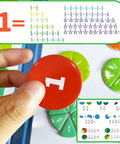 Hand holding circular piece from Magnetic Fraction Tiles And Circles Set For Hands On Math Fun, showing fraction on whiteboard.