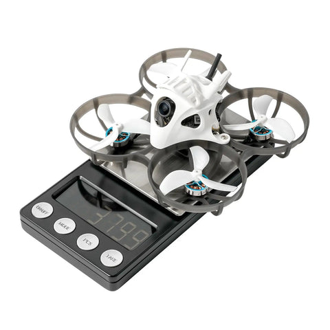 Meteor75 Pro P1 1S Cinewhoop Drone Dope 1080P P1 Air Unit HD VTX on digital scale showing weight