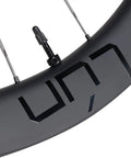 Close-up of Routte3 Carbon Road Wheelset 700C Ultralight Beast 1390g Disc Brake Clincher Tubeless Ready with matte black decal.