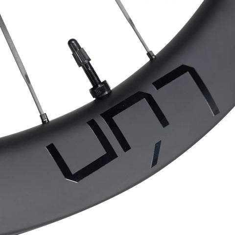 Close-up of Routte3 Carbon Road Wheelset 700C Ultralight Beast 1390g Disc Brake Clincher Tubeless Ready with matte black decal.