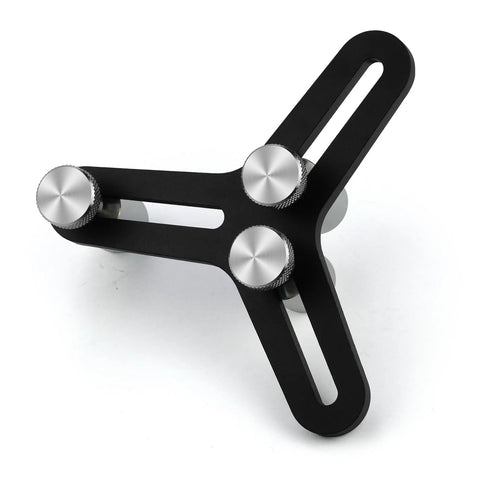 Angled view of universal piston ring squaring tool with three knurled adjustment knobs and slotted arms.