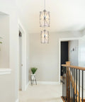 Modern Cylindrical Pendant Light With Frosted Glass Shade In Brushed Nickel For Kitchen Island Lighting Hanging Over Island Foyer And Dining Room Soft Warm Glow And Sleek Contemporary Vibe Easy Install in hallway view.