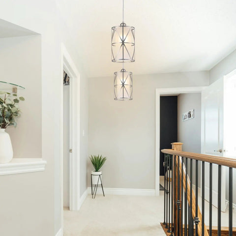 Modern Cylindrical Pendant Light With Frosted Glass Shade In Brushed Nickel For Kitchen Island Lighting Hanging Over Island Foyer And Dining Room Soft Warm Glow And Sleek Contemporary Vibe Easy Install in hallway view.