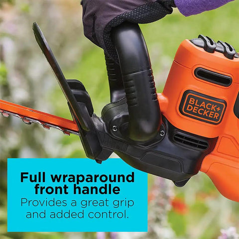 Close-up of 22 Inch Electric Hedge Trimmer With Dual Action Blades And Full Wraparound Handle in use.