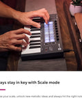 Hands playing Portable 25 Key MIDI Keyboard Controller with USB Connectivity in studio setting
