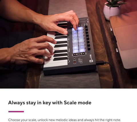 Hands playing Portable 25 Key MIDI Keyboard Controller with USB Connectivity in studio setting