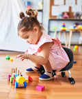 Child playing with blocks on Low Profile Rolling Stool On Wheels With Back Rest And Leather Cushion 360 Degree Swivel Compact Round Seat