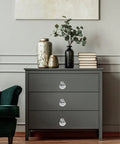Gray dresser with Crystal Acrylic Cabinet Knobs With Silver Base, 10 Pack Modern Drawer Pulls For Home Decor And Kitchen Storage installed.