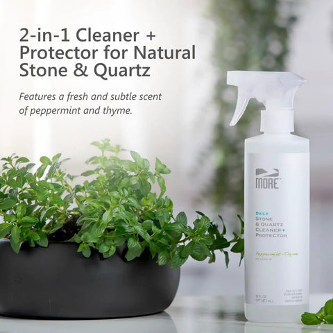 All In One Stone And Quartz Cleaner And Protector Spray For Granite Marble And Quartz Surfaces On Kitchen And Bath Counters And Floors Water Based Neutral PH Formula With Peppermint Thyme Essential Oil 16 Oz bottle next to potted plant