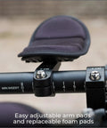 Close-up of aluminum two piece aero bars for road bikes with J bend design, showing adjustable arm pads and foam padding.