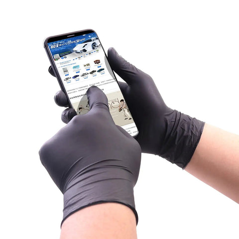Person wearing Black Nitrile Gloves 4 Mil Disposable 100 Pack Large Size Powder Free Latex Free Durable Exam Gloves using smartphone