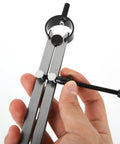 Close-up of an 8-inch divider caliper with screw adjustment and metal legs, held in hand