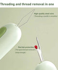 Close-up of 3 Pack 2 In 1 Seam Ripper And Needle Threader Set For Hand Sewing, showing green dual function tool with sharp steel tips