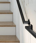 Matte Black Industrial Pipe Stair Handrail Crafted For Indoor And Outdoor Use Featuring A Super Heavy Duty Galvanized Steel Build along wooden stairs.