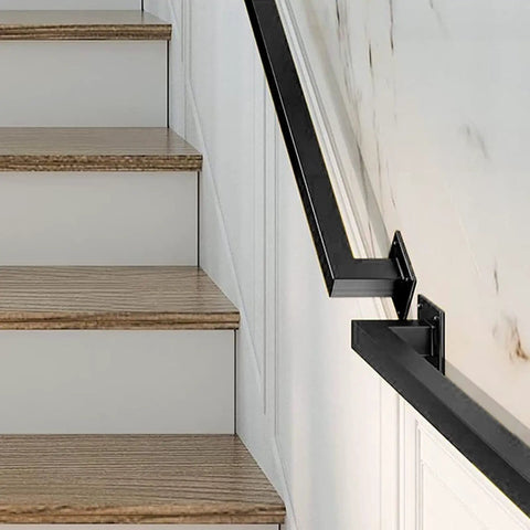 Matte Black Industrial Pipe Stair Handrail Crafted For Indoor And Outdoor Use Featuring A Super Heavy Duty Galvanized Steel Build along wooden stairs.