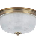 Vintage Brass Two Light Close To Ceiling Flush Mount Fixture In Archie Collection Style with prismatic glass dome.