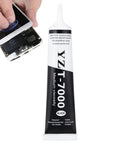 Tube of Ultra Strong T7000 Phone Repair Glue near a smartphone, used for screen and frame repairs, multipurpose adhesive.