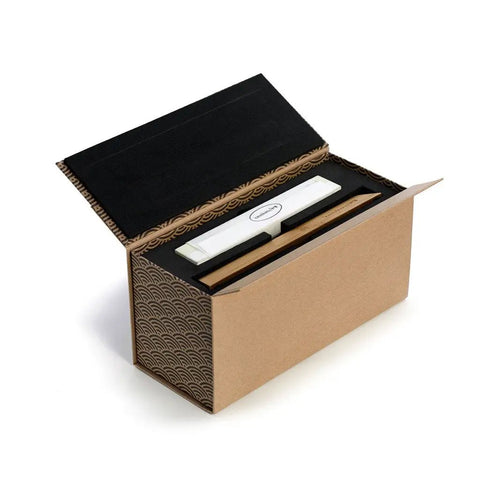 Toishi Sharpening Whetstone With 1000 And 3000 Grit For Knife Edge Maintenance in opened packaging with bamboo stand and guide.