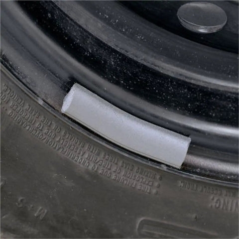 Close-up of tire rim with scuffed finish, featuring All Purpose Abrasive Sanding Sheet For Auto Body Prep And DIY Projects.