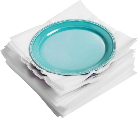 A teal plate resting on a stack of 100 Cushion Foam Pouches And Sheets For Moving Protect Fragile Stuff Like Mugs Cups Glasses China And Dishes.