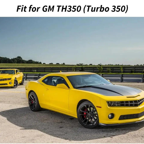 Bright yellow sports cars, fit for GM TH350 transmission, parked on a race track with clear skies.