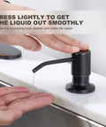 Person using soap dispenser from Oil Rubbed Bronze Kitchen Faucet With Soap Dispenser, 16 Inch High Arc Pull Down, Single Handle, Deck Plate