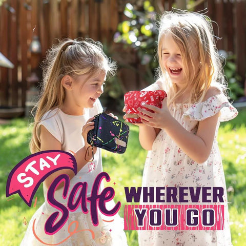 Kids' fabric pouches for a mini first-aid kit, two colorful pouches held by two girls outdoors.
