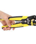 Jauarta 5-In-1 Automatic Wire Stripper Tool for Electricians Heavy Duty Crimper Cutter And Peeler Pliers held in hand with yellow design.